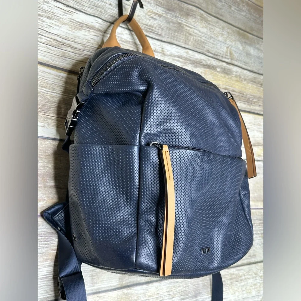 Tumi Navy Perforated Leather Backpack with Tan Handles